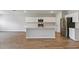 Open concept kitchen with island and stainless steel appliances at 2204 Canyon Oak Dr, Davenport, FL 33837