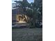 Backyard of home with lush, tropical plants around the screened pool offering a private outdoor retreat at 113 Walton Heath Dr, Orlando, FL 32828