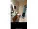 Bathroom featuring a glass bowl sink, updated fixtures, and a shower at 113 Walton Heath Dr, Orlando, FL 32828