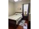 Comfortable bedroom with wood flooring, neutral color scheme, and a large window at 113 Walton Heath Dr, Orlando, FL 32828