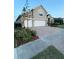 Charming single-Gathering home with a spacious three-car garage and meticulously paved driveway at 113 Walton Heath Dr, Orlando, FL 32828