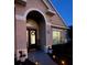 Close-up of the home's entrance, highlighting the front door and outdoor lighting at 113 Walton Heath Dr, Orlando, FL 32828