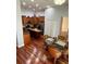 Open kitchen and dining area with wooden cabinets, stainless steel appliances, and island at 113 Walton Heath Dr, Orlando, FL 32828