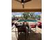 Covered outdoor dining area with an inviting pool view, perfect for entertaining and relaxation at 113 Walton Heath Dr, Orlando, FL 32828