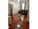 Living room with hardwood floors, comfortable seating, and natural light at 113 Walton Heath Dr, Orlando, FL 32828