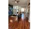 Spacious living area with hardwood floors, seamlessly connected to other living spaces in the home at 113 Walton Heath Dr, Orlando, FL 32828