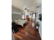 Spacious main bedroom with vaulted ceiling, wood floors, a ceiling fan, and lots of natural light at 113 Walton Heath Dr, Orlando, FL 32828