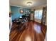 Bright office space with hardwood floors, a large window, and neutral decor at 113 Walton Heath Dr, Orlando, FL 32828