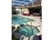 Beautiful screened in pool and spa with an outdoor seating area perfect for relaxation and entertaining at 113 Walton Heath Dr, Orlando, FL 32828