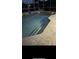 Inviting backyard pool area is highlighted by stone tile and multiple steps, perfect for relaxing in style at 113 Walton Heath Dr, Orlando, FL 32828