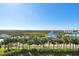 Aerial view of property showing expansive water and green landscape views at 4650 Links Village Dr # C703, Ponce Inlet, FL 32127