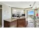 Modern kitchen island with granite countertop and breakfast bar at 4650 Links Village Dr # C703, Ponce Inlet, FL 32127