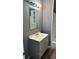Bathroom with grey vanity and a large mirror at 1112 W 12Th St, Lakeland, FL 33805
