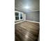 Spacious bedroom with grey walls and wood-look flooring at 1112 W 12Th St, Lakeland, FL 33805