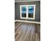 Bedroom with grey walls and wood-look flooring at 1112 W 12Th St, Lakeland, FL 33805