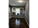Living room with built-in shelving and large windows at 1112 W 12Th St, Lakeland, FL 33805
