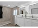 Modern bathroom with double vanity and large walk-in shower at 27100 Racquet Cir, Leesburg, FL 34748