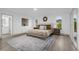 Bright bedroom with plush bed and access to backyard at 27100 Racquet Cir, Leesburg, FL 34748