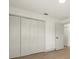 Clean bedroom features a built-in closet to maximize space and storage at 27100 Racquet Cir, Leesburg, FL 34748