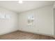 Bright bedroom with hardwood floors and white trim provides a clean, modern aesthetic at 27100 Racquet Cir, Leesburg, FL 34748