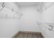 Large closet with wire shelving and hanging rods at 27100 Racquet Cir, Leesburg, FL 34748