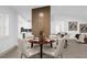 Open concept dining area with modern table and chairs, view of kitchen at 27100 Racquet Cir, Leesburg, FL 34748