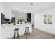 Eat-in kitchen with breakfast bar and modern finishes at 27100 Racquet Cir, Leesburg, FL 34748
