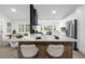Modern kitchen with large island, perfect for entertaining, and breakfast bar at 27100 Racquet Cir, Leesburg, FL 34748