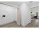 Convenient laundry room with shelving and access to another bedroom at 27100 Racquet Cir, Leesburg, FL 34748