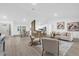 Spacious living room with hardwood floors and open concept design at 27100 Racquet Cir, Leesburg, FL 34748