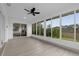 Sun-filled room with windows all around overlooking a green, scenic view at 27100 Racquet Cir, Leesburg, FL 34748