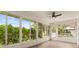 Bright sunroom with lots of windows overlooking the garden at 27100 Racquet Cir, Leesburg, FL 34748