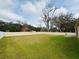 Large backyard with a fenced perimeter and grassy lawn at 2793 Hudson St, Lakeland, FL 33810