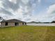 Large backyard with a fenced perimeter and grassy lawn at 2793 Hudson St, Lakeland, FL 33810