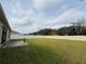 Large backyard with a fenced perimeter and grassy lawn at 2793 Hudson St, Lakeland, FL 33810