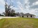 Large backyard with a fenced perimeter and grassy lawn at 2793 Hudson St, Lakeland, FL 33810