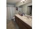Clean bathroom with double vanity and shower/tub combo at 2793 Hudson St, Lakeland, FL 33810