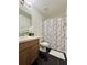 Clean bathroom with single vanity and shower/tub combo at 2793 Hudson St, Lakeland, FL 33810