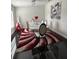 Modern dining room with a glass table and red rug at 2793 Hudson St, Lakeland, FL 33810