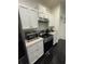 Kitchen with stainless steel appliances and white cabinets at 2793 Hudson St, Lakeland, FL 33810