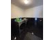Laundry room featuring washer, dryer, and dark tile floors at 2793 Hudson St, Lakeland, FL 33810