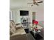 Spacious living room with reclining sofas and a large TV at 2793 Hudson St, Lakeland, FL 33810