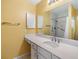 Updated bathroom with walk-in shower and grab bars at 3096 Lansing Way, The Villages, FL 32162