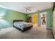 Bright bedroom with ensuite bathroom access at 3096 Lansing Way, The Villages, FL 32162