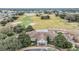 Community clubhouse with parking and patio area at 3096 Lansing Way, The Villages, FL 32162