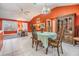 Dining room with a wooden table and access to living room at 3096 Lansing Way, The Villages, FL 32162