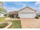 One-story home with attached garage and landscaped yard at 3096 Lansing Way, The Villages, FL 32162