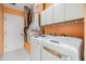 Laundry room with washer, dryer, and cabinets at 3096 Lansing Way, The Villages, FL 32162