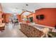 Spacious living room with tile floors and a view of the kitchen at 3096 Lansing Way, The Villages, FL 32162