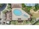 Aerial view of resort-style pool with surrounding lounge chairs at 3096 Lansing Way, The Villages, FL 32162